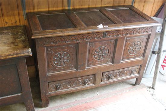 Carved oak triple panel mule chest(-)